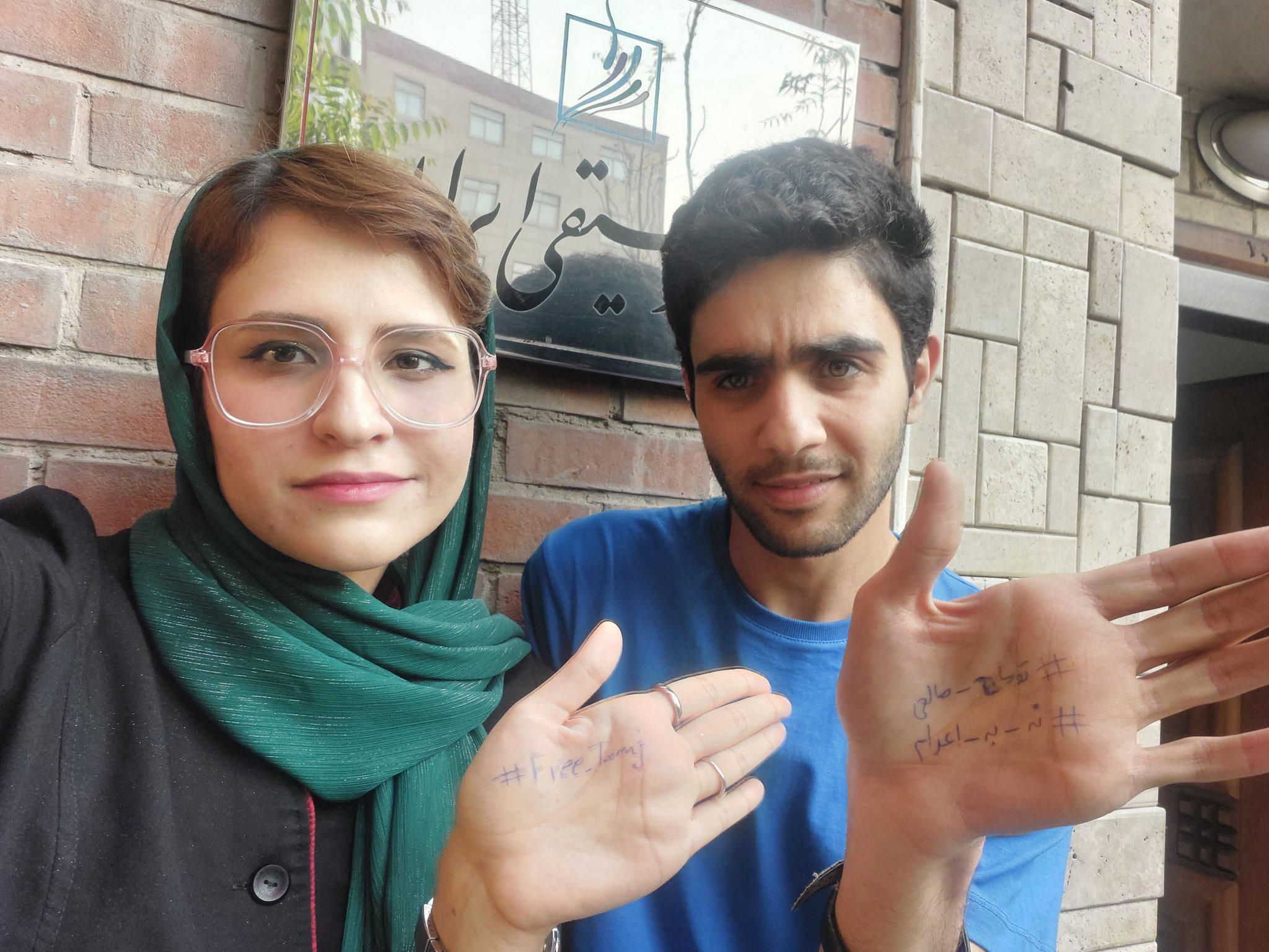 Iran gives jail terms to two students for protesting rapper’s death sentence