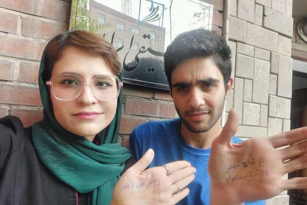 Iran gives jail terms to two students for protesting rapper’s death sentence