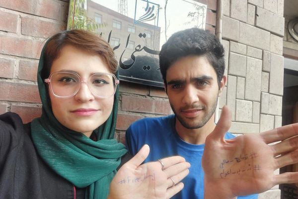 Iran gives jail terms to two students for protesting rapper’s death sentence