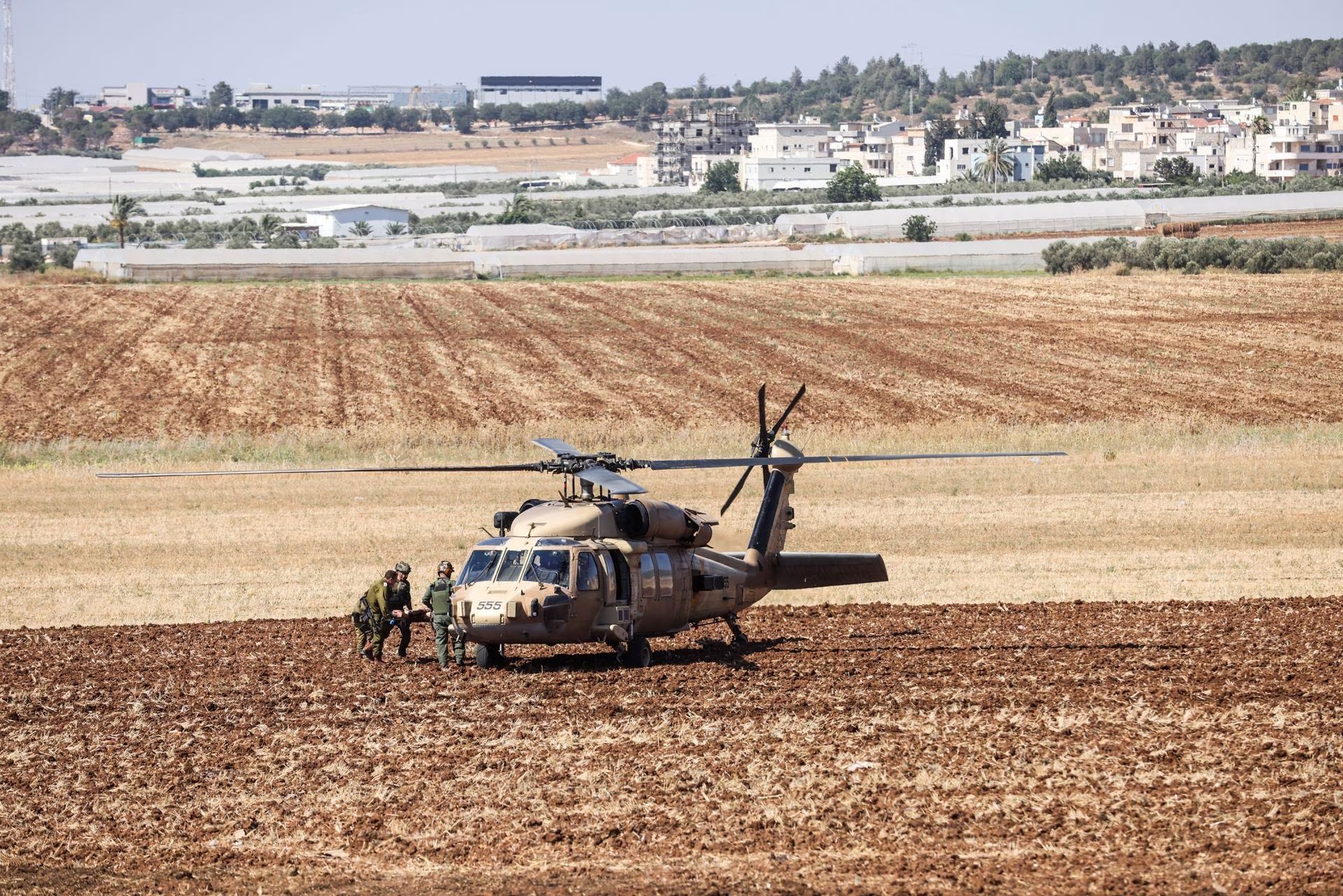 sraeli military carry a wounded person on a stretcher to a helicopter during a raid on Jenin refugee camp near Salem checkpoint, the entrance from Israel to Jenin in the West Bank, July 3, 2023