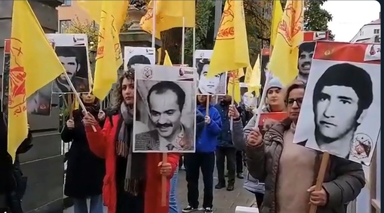 Iranian protesting in Stockholm with pictures of 1988 victims