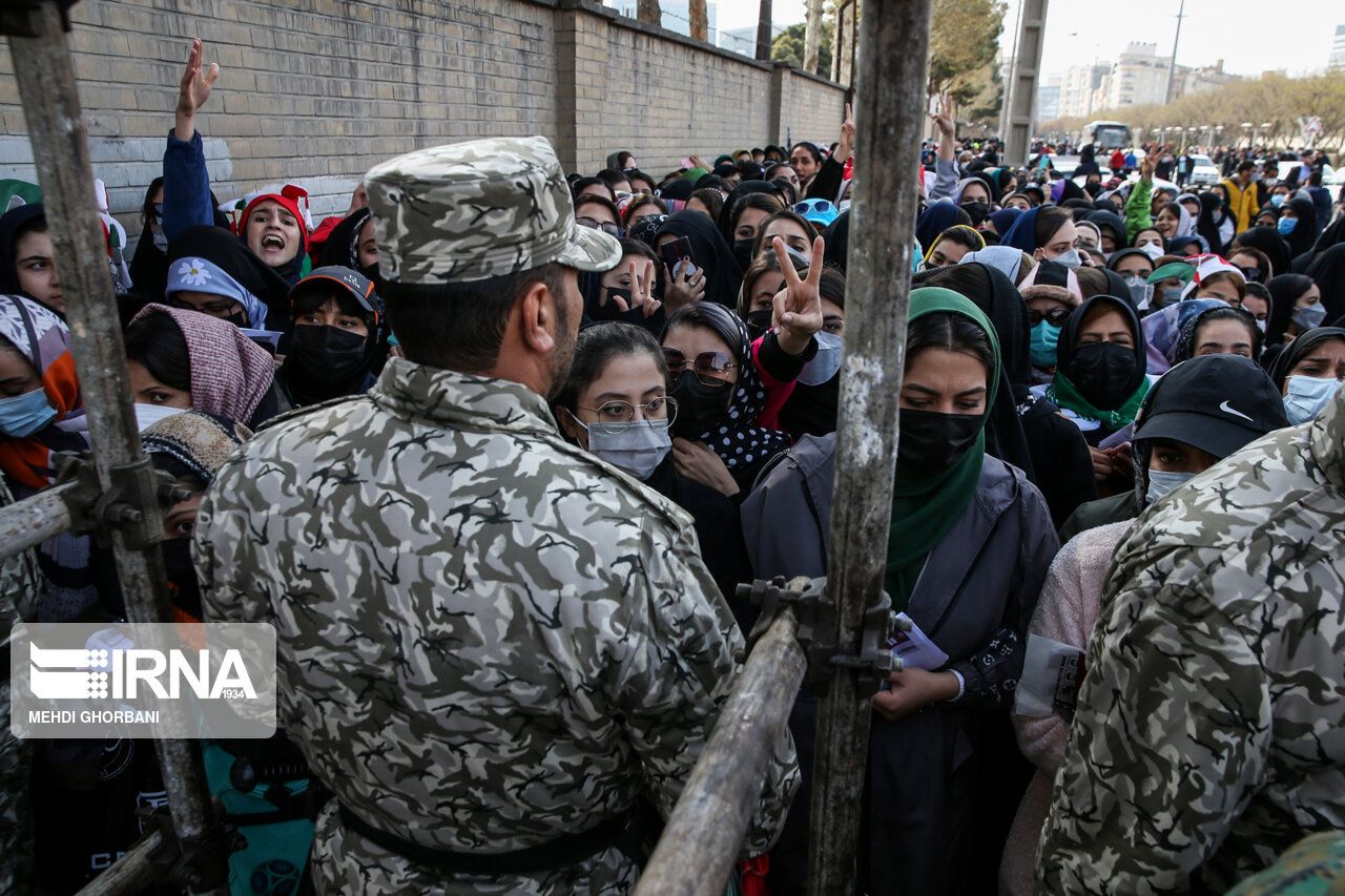 Security forces barring women from entering the football stadium in Mashhad. March 29, 2022