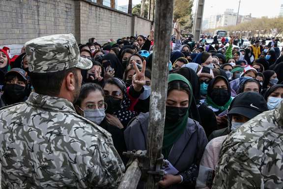 Security forces barring women from entering the football stadium in Mashhad. March 29, 2022