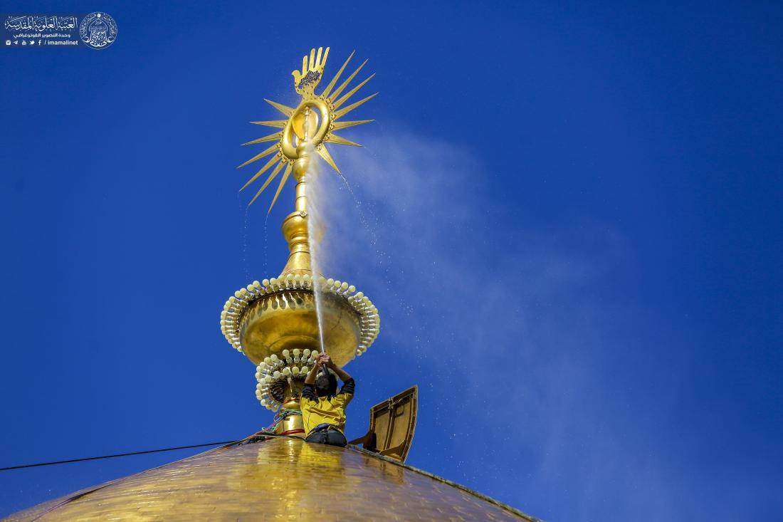 Iranian workers are washing the dome of the shrine of first Shiite Imam Ali ibn Abi Ṭalib. (February 2022) 