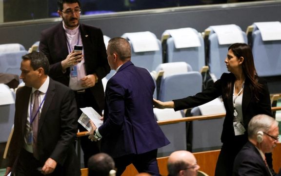 Israel's Ambassador to the United Nations Gilad Erdan is led out of the United Nations General Assembly hall by security officials on September 19, 2023.