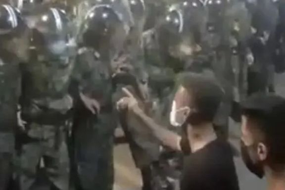 An Iranian protester confronting special police units trained to crush protests