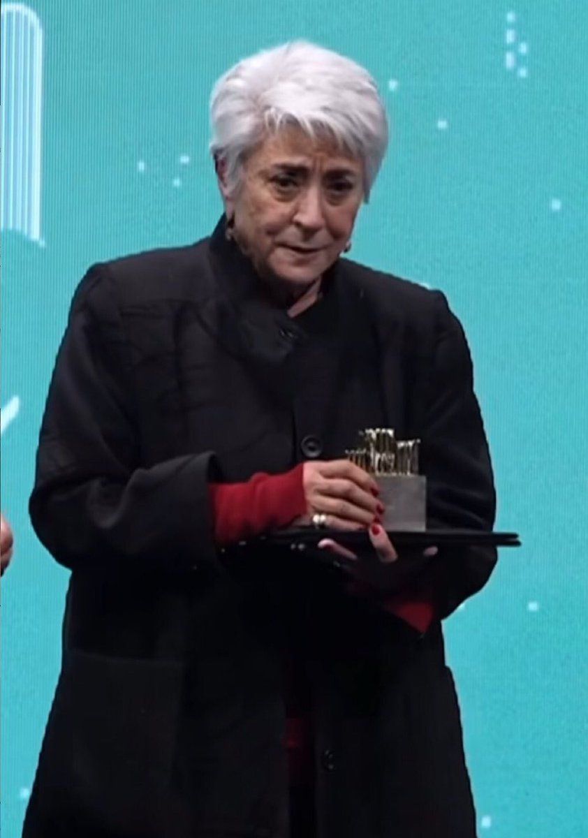 Prominent writer Goli Emami holding her award. December 26, 2024