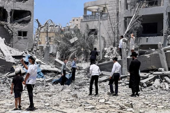 People look at an impacted site following missile attack from Iran on Israel, in Bnei Brak, Israel June 16, 2025.