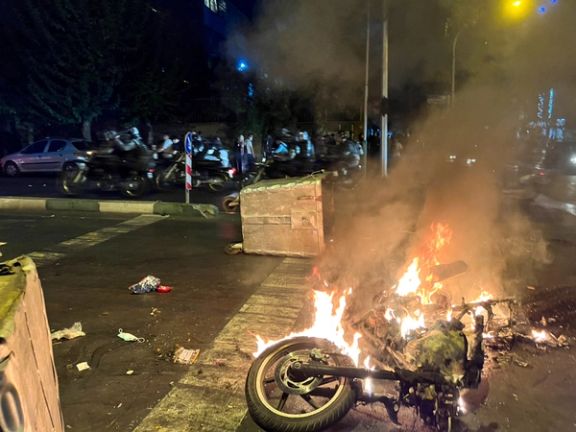 Protesters set fire to a motorcycle of the security forces as protests began on September 19, 2022