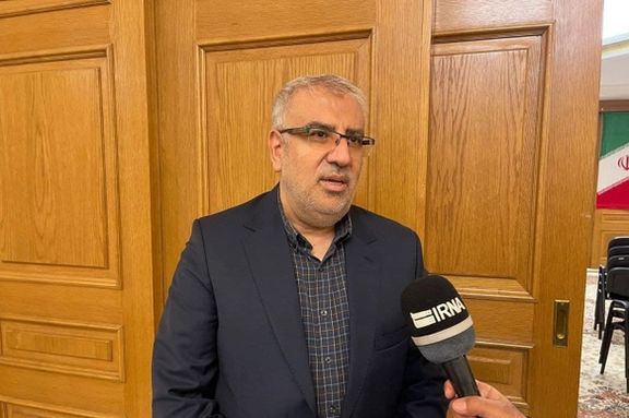 Iran's oil minister Javad Owji speaking to an Iranian reporter. Undated