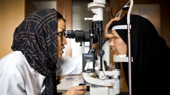 An Iranian ophthalmologist examining a patient