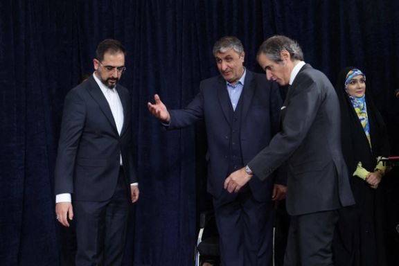 Head of Iran's Atomic Energy Organization Mohammad Eslami and International Atomic Energy Agency (IAEA) Director General Rafael Grossi arrive at a news conference, in Tehran, March 4, 2023