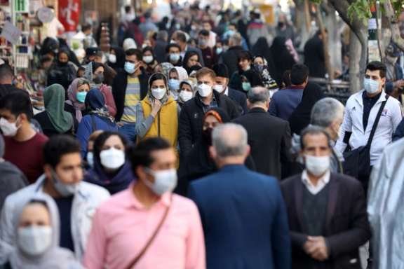 Crowds walk in a Tehran street in November 2021.