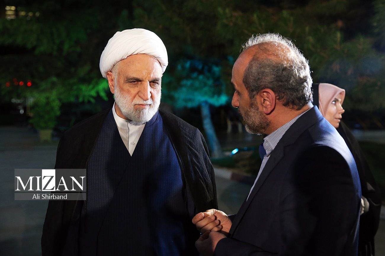 Iran's chief justice Gholamreza Mohseni-Ejei talking to the head of state broadcaster IRIB, Peyman Jebelli, on June 21, 2023 
