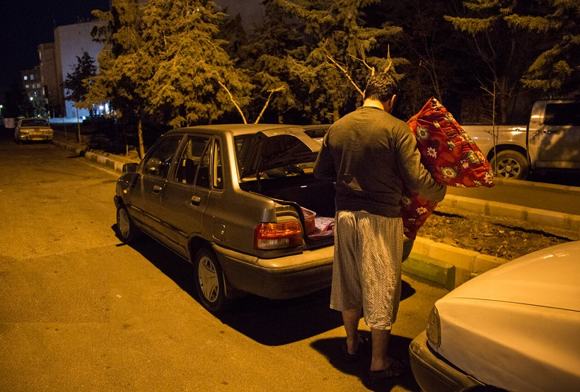 An internet taxi driver preparing to sleep in his car