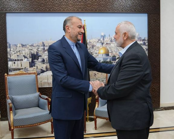Iranian Foreign Minister Hossein Amir-Abdollahian (left) and Hamas leader Ismail Haniyeh in Doha, Qatar, on October 31, 2023