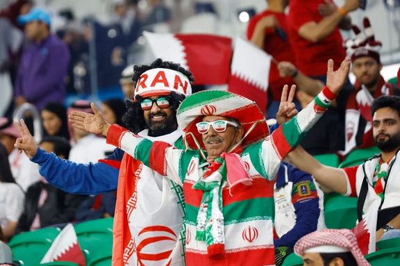 Iranian fans wearing the Islamic Republic flag before Iran’s semifinal match against Qatar in Doha, February 7, 2024