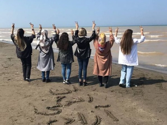A group of Iranian women flashing victory sign to express support for the ‘Women, Life, Liberty; movement