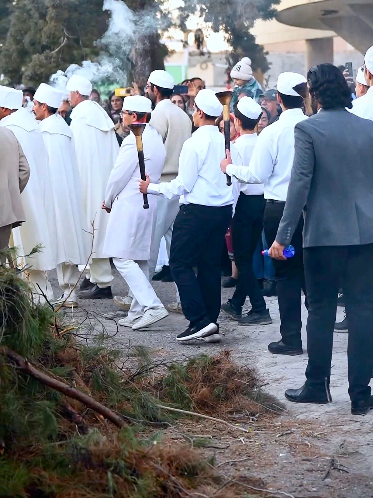 Zoroastrian fire priests carrying embers to light the Sadeh fire in Kerman
