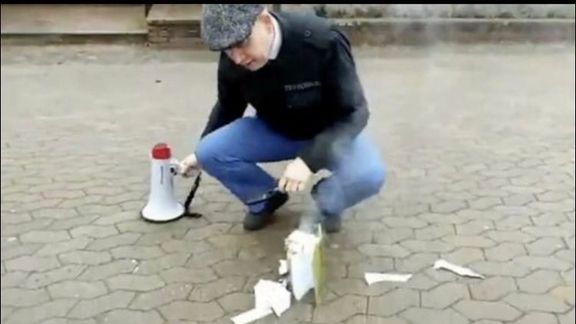 Leader of the Danish far-right political party Stram Kurs or Hard Line, Rasmus Paludan, is burning a copy of Quran in the southern Swedish city of Linköping on April 14, 2022.