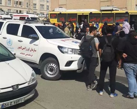People gathered at the scene of one of the chemical attacks on schoolgirls in the capital Tehran.