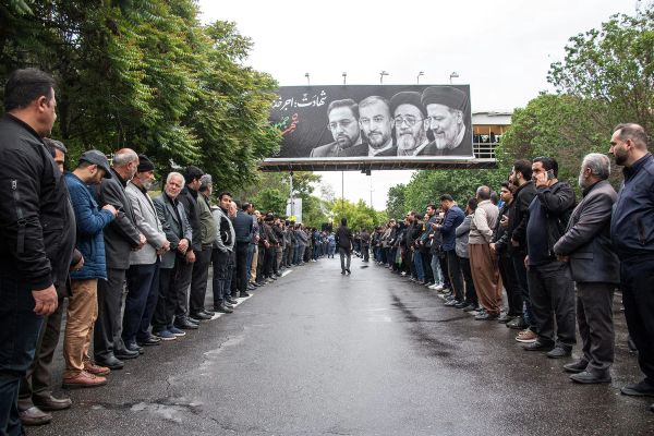 German Journalists Attacked at Iranian President’s Funeral