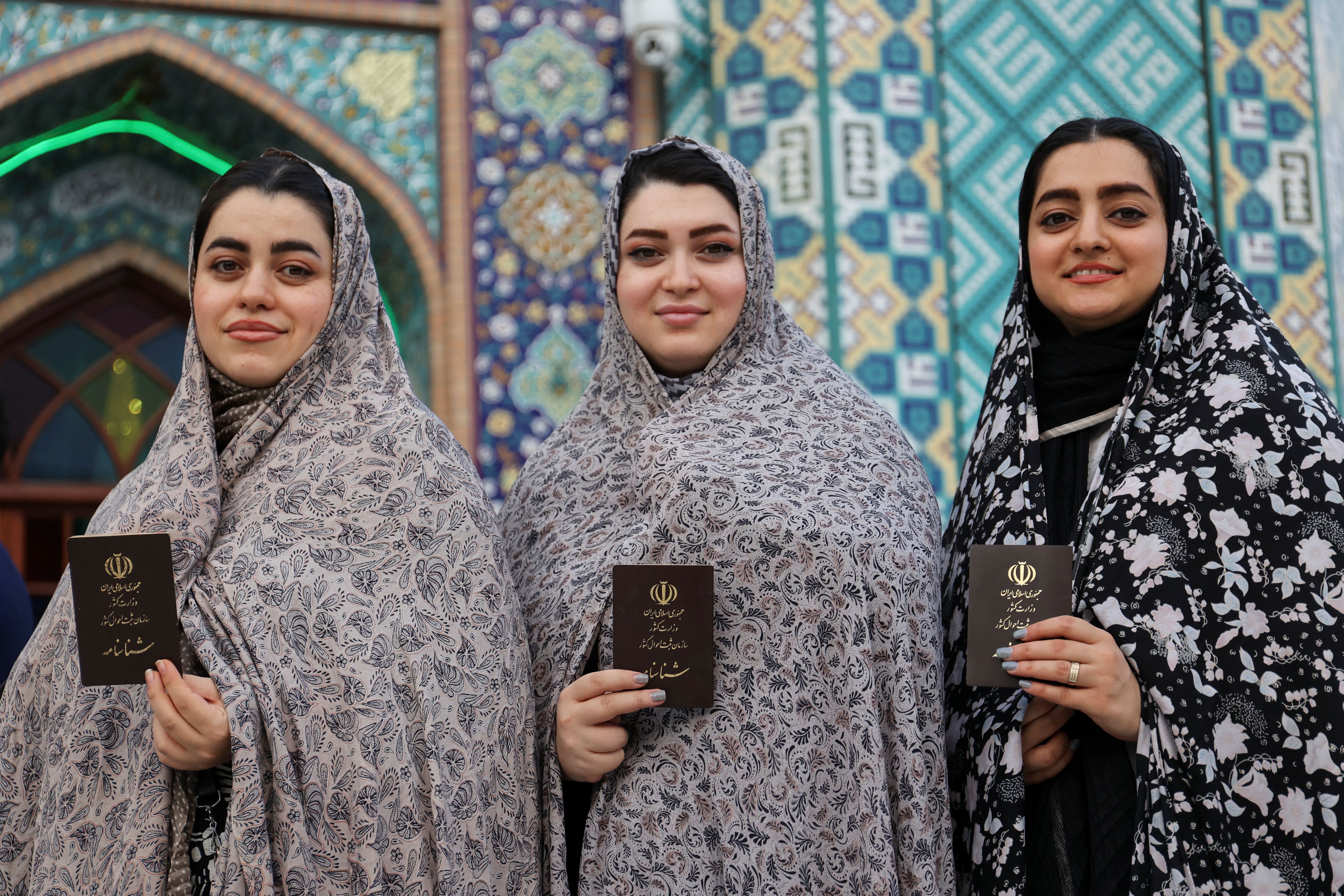 Iranian women pose on the day of a snap presidential election to choose a successor to Ebrahim Raisi following his death in a helicopter crash, in Tehran, Iran June 28, 2024. 