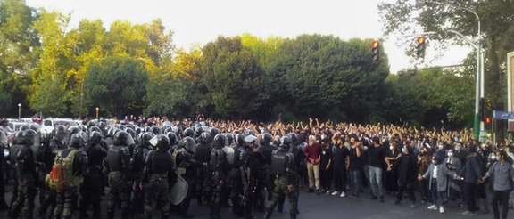 A scene from hundreds of anti-riot security forces confronting protesters in Tehran on September 19