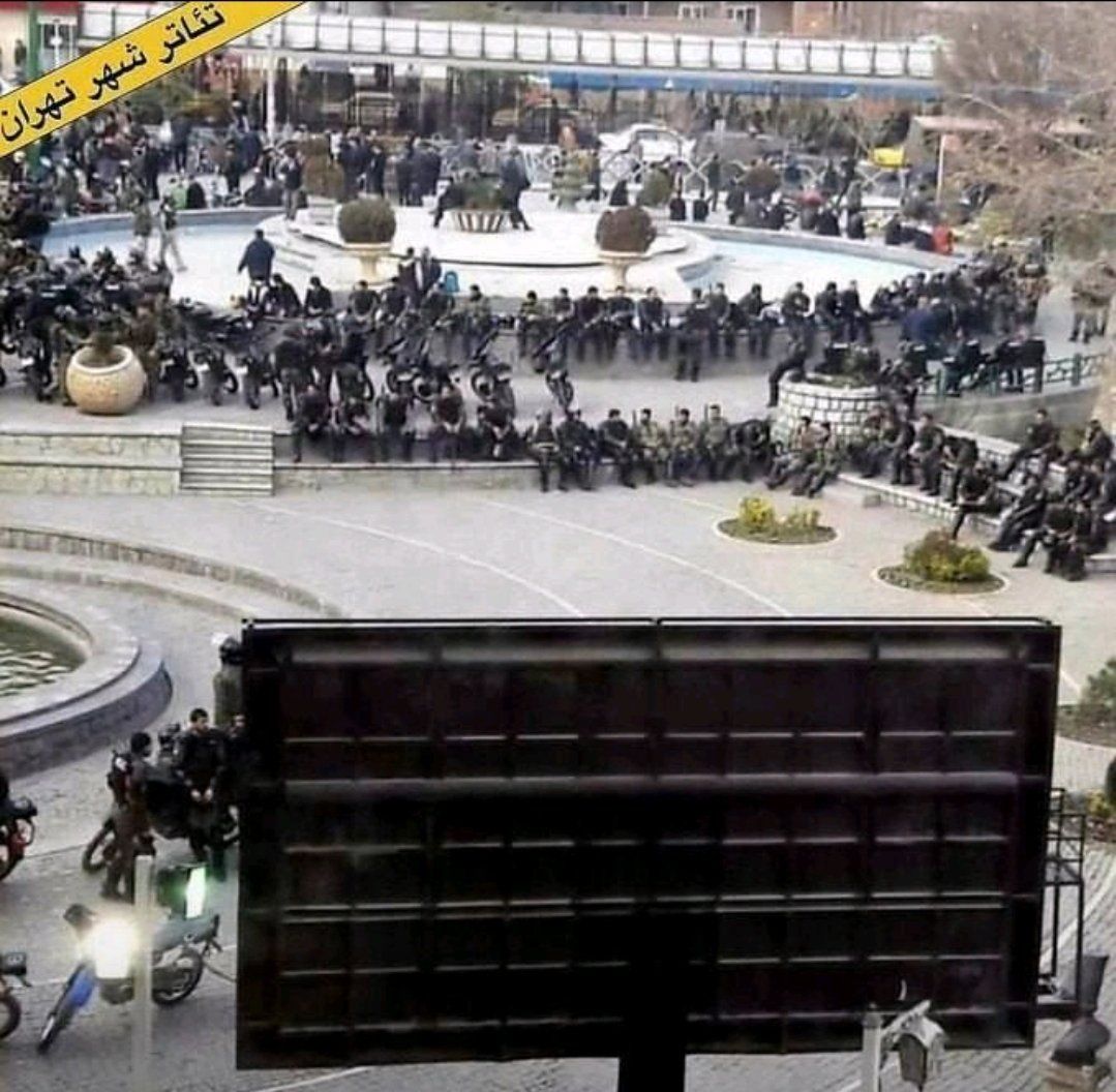 Morality police officers taking rest outside Tehran’s City Theater 