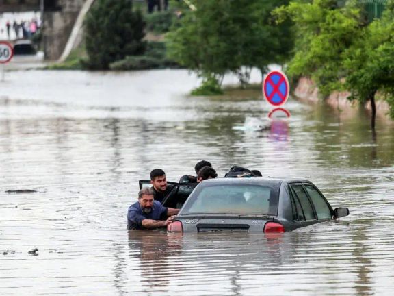 A car submerged following flooding in Mashhad.