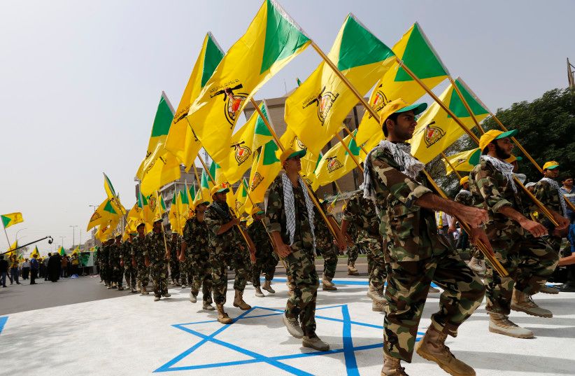 Iran-backed Kata’ib Hezbollah members parade during a parade in Baghdad, Iraq   (undated)
