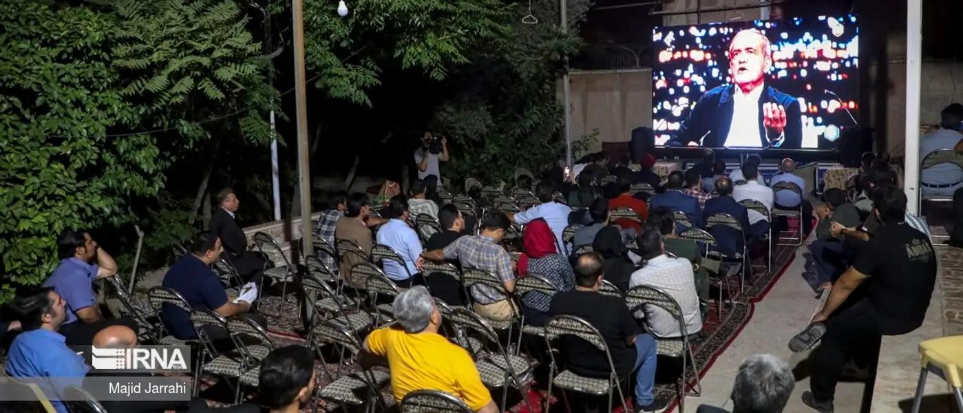 A group of Iranians watching the first presidential debate on June 17, 2024