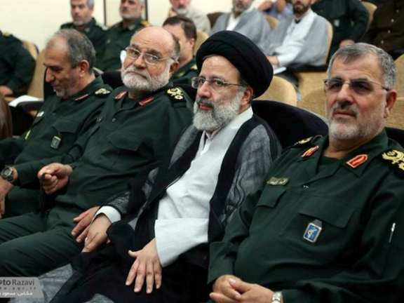 An undated photo showing Iranian President Raisi with IRGC commanders