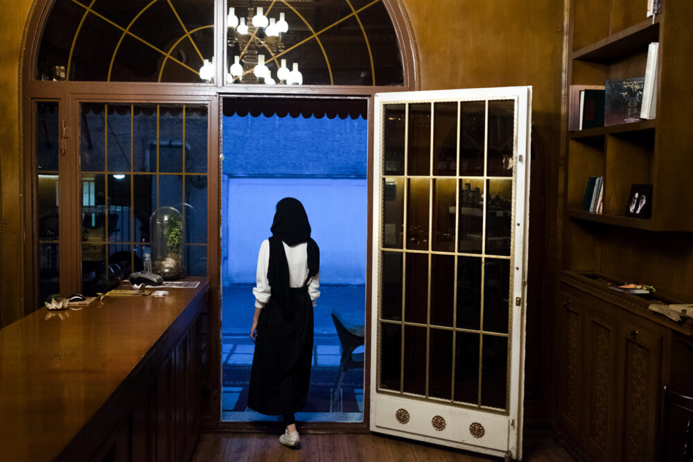 File photo by ISNA shows a woman leaving a cafe in Tehran
