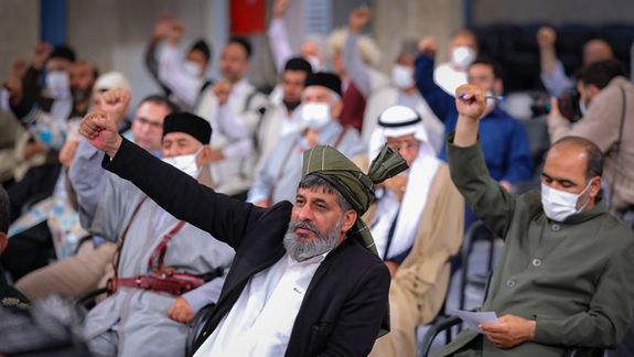 Some of the people present at Khamenei's speech gesturing in support of slogans