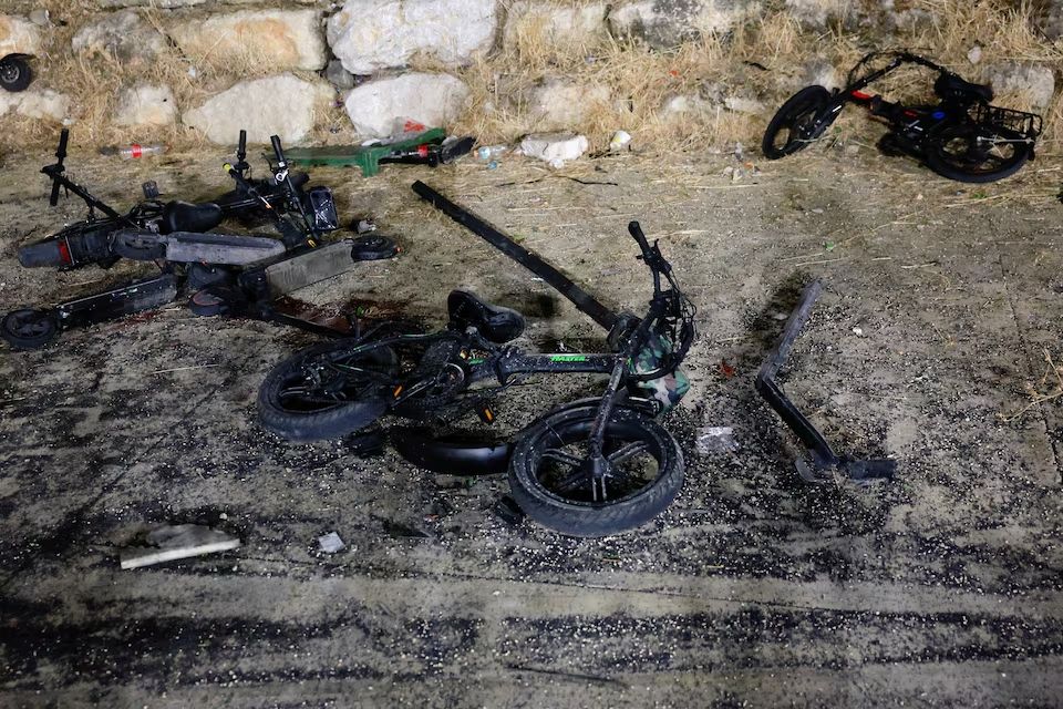Damaged bikes are pictured after rockets were launched across Lebanon's border with Israel which, according to Israel's ambulance services, people were killed, at a soccer pitch in Majdal Shams, a Druze village in the Israeli-occupied Golan Heights, July 27, 2024.