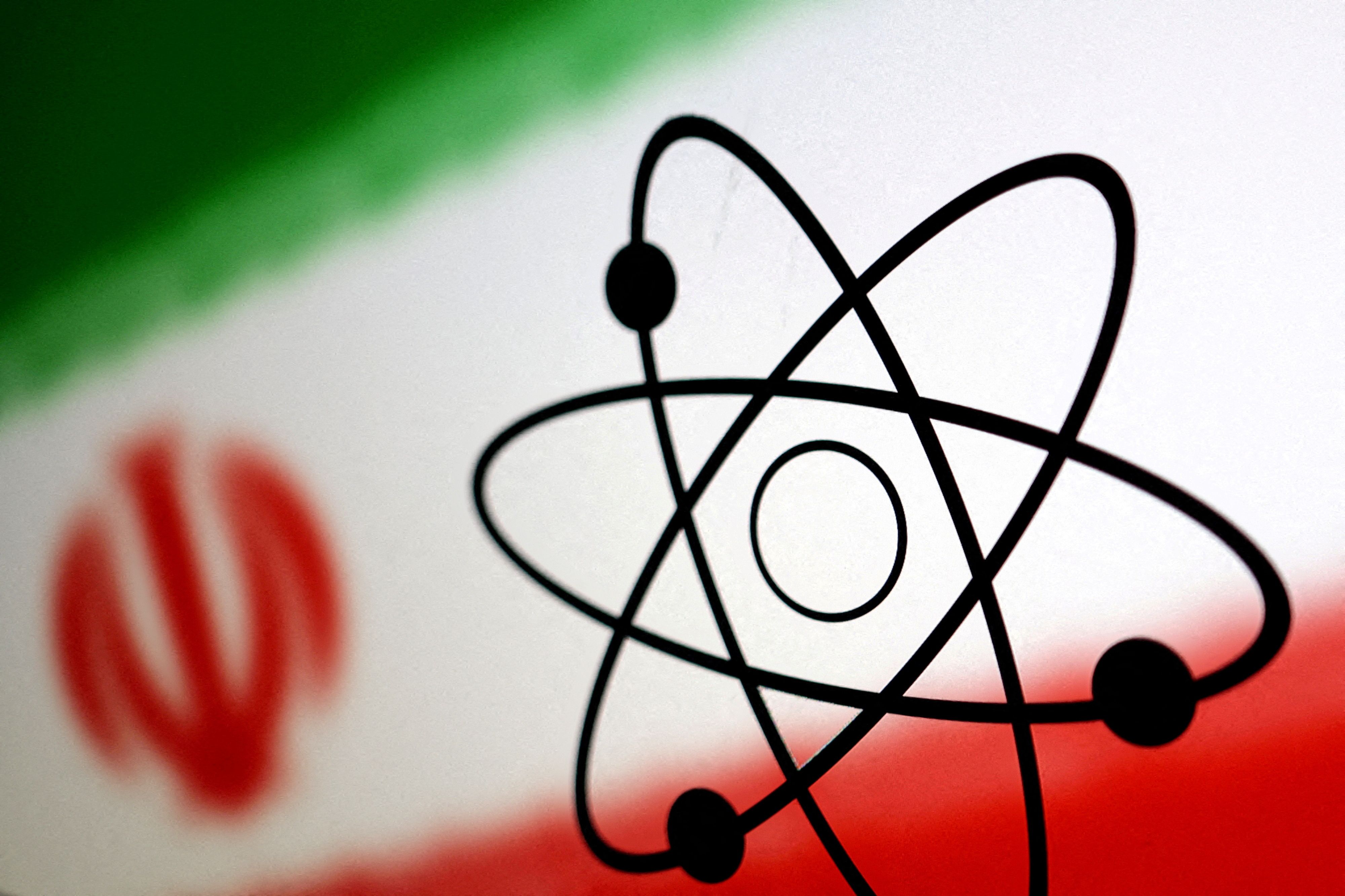 The atomic symbol and the Iranian flag, Reuters