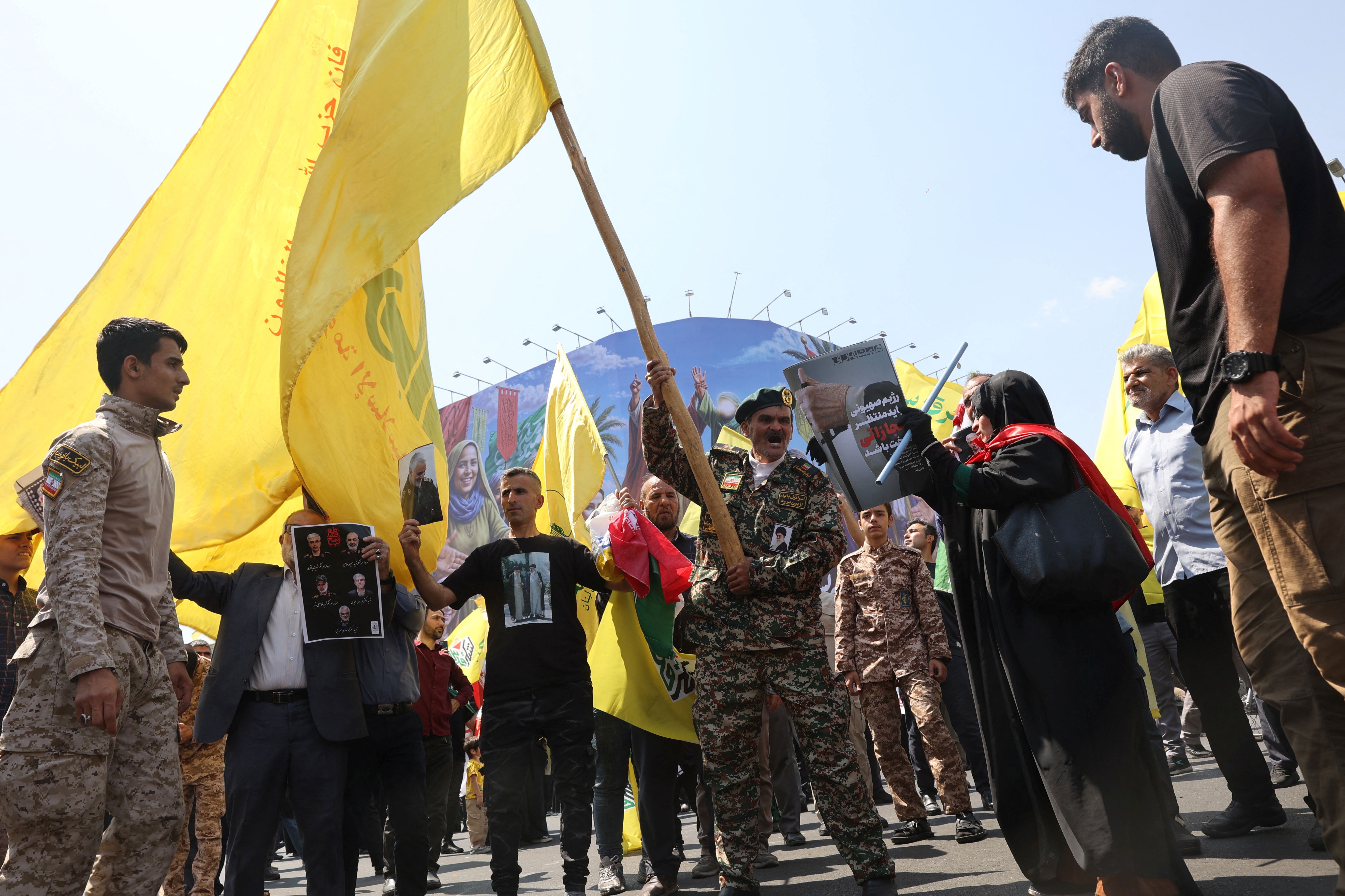 People attend an anti-Israeli protest following the Israeli strikes on Iran, in Tehran, Iran, June 13, 2025. 