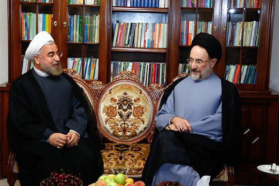 Former Iranian presidents Hassan Rouhani (L) and Mohammad Khatami