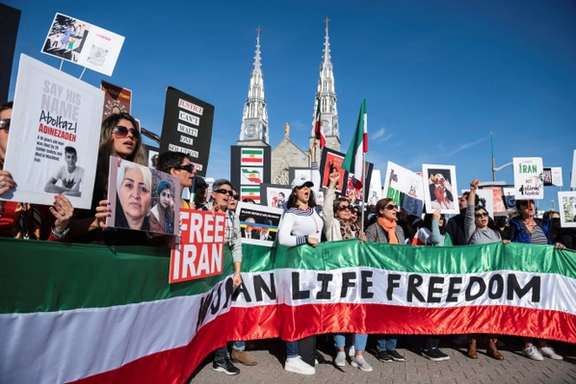 Protestors in support of women in Iran hold a banner reading 'Women Life Freedom' during a protest following the death of Mahsa Amini, in Ottawa, Ontario, Canada, October 29, 2022.