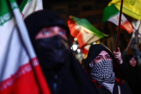 Women covering their faces attend a state-sponsored rally against Israel and the United States, Tehran, Iran, April 22, 2026