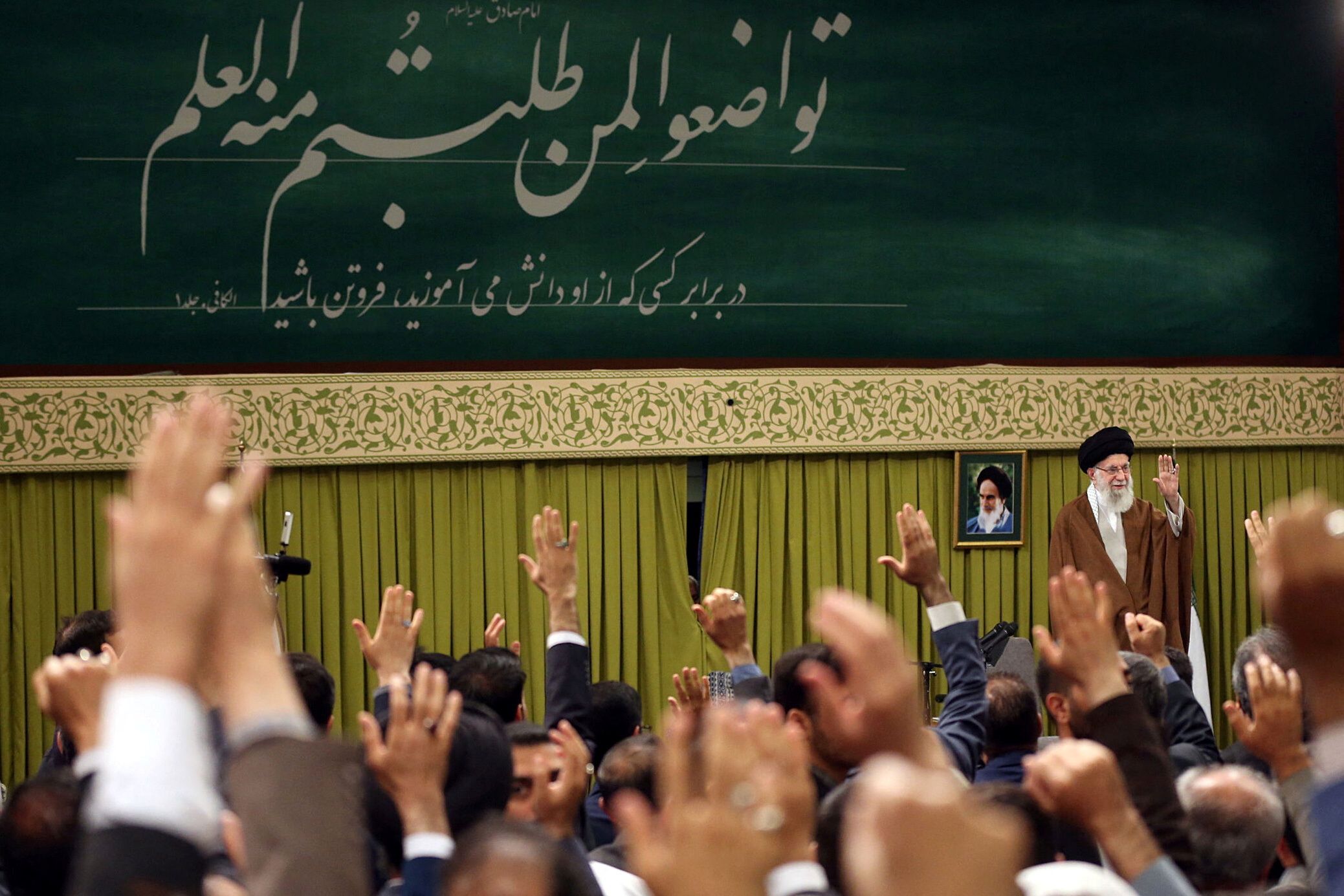 Iran's Supreme Leader Ali Khamenei waves during a meeting with teachers in Tehran, Iran May 1, 2024.
