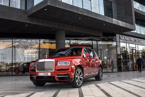 Jugwinder Singh Brar gestures as he drives a newly purchased Rolls-Royce Cullinan from a Dubai dealership, March 2020.