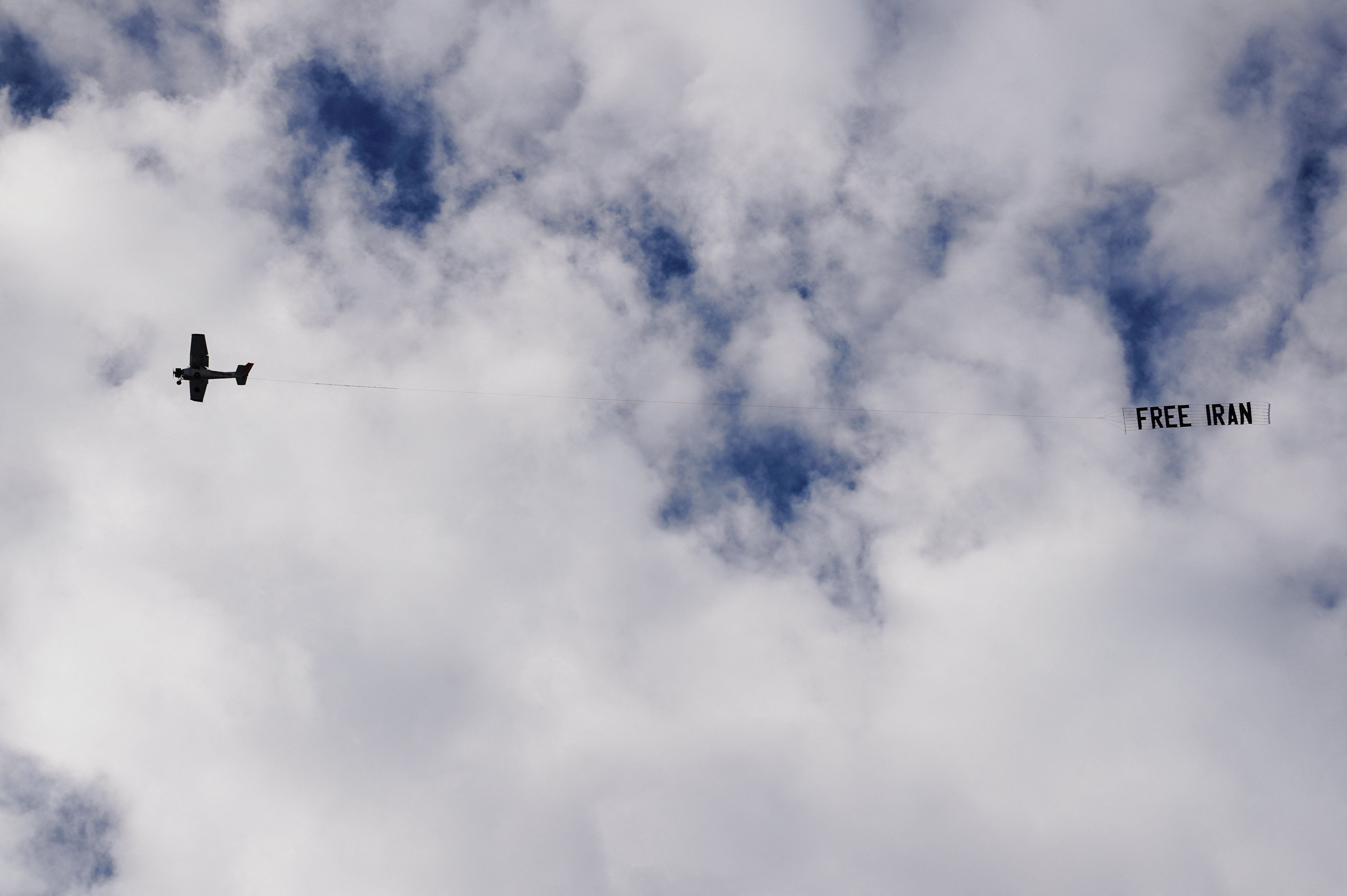 A small aircraft flies over the city while carrying a banner reading "Free Iran," as part of demonstrations supporting nationwide protests in Iran, in Los Angeles, California, January 18, 2026.