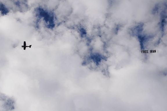 A small aircraft flies over the city while carrying a banner reading "Free Iran," as part of demonstrations supporting nationwide protests in Iran, in Los Angeles, California, January 18, 2026.