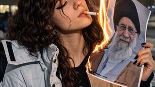 Lighting cigarette with burning Khamenei portrait becomes protest symbol