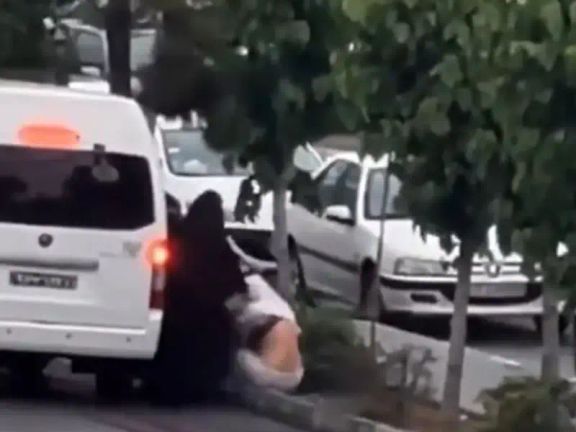 A woman being detained by morality police in Tehran during hijab crackdown