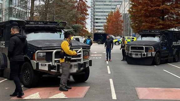 Armored police vehicles are seen outside the headquarters of Iran International on November 19, 2022