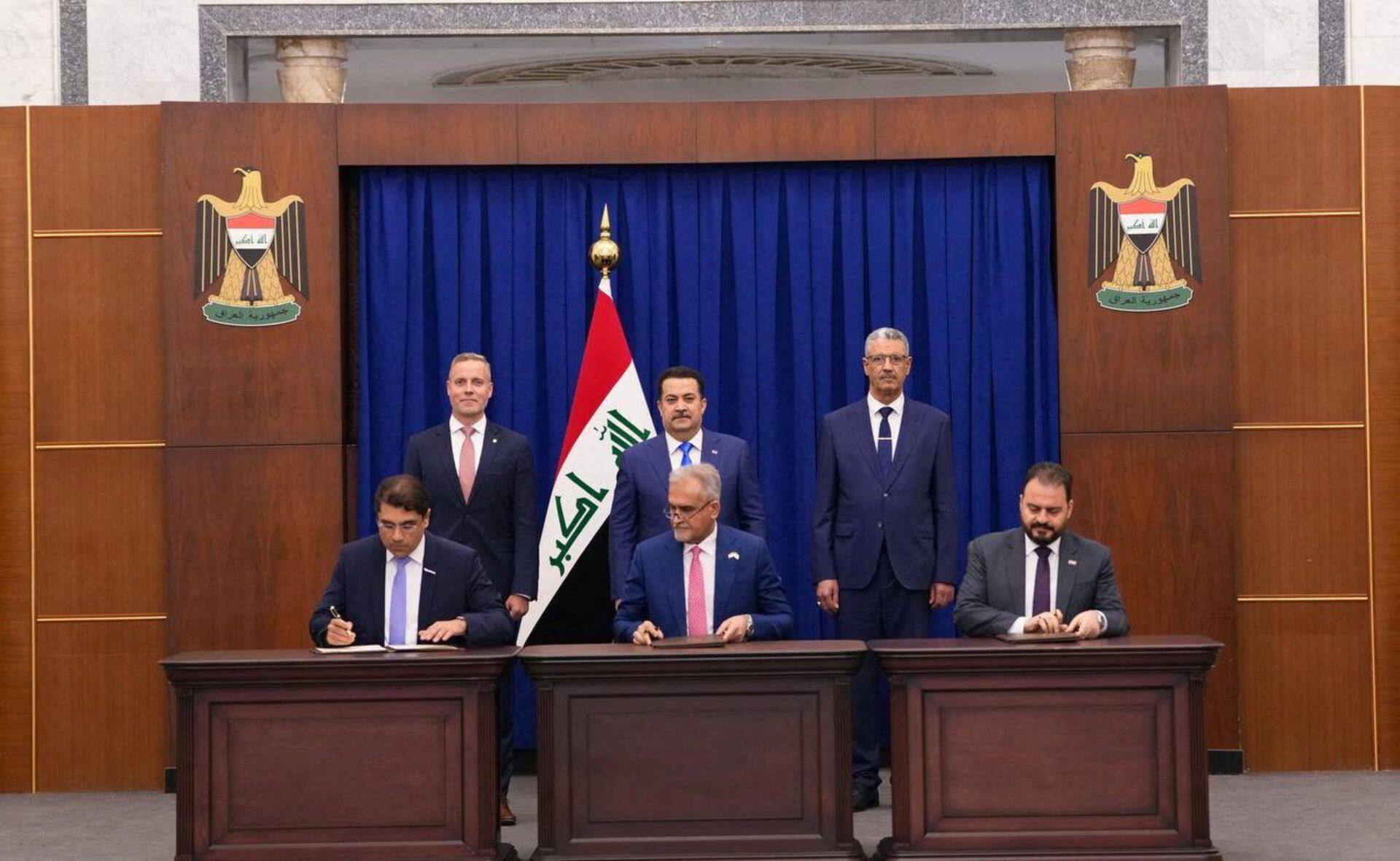 Iraqi Prime Minister Mohammed Shia al-Sudani attends a signing ceremony for a preliminary agreement between Iraq's Oil Ministry and Exxon Mobil to develop the Majnoon oil field, in Baghdad, Iraq, October 8, 2025