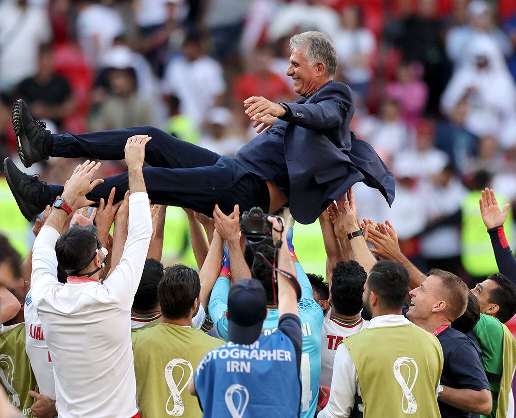 Iranian players celebrating after their World Cup victory against Wales on November 25, 2022